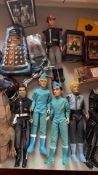 Mixed lot of Gerry Anderson and other sci-fi action figures and tins