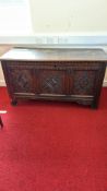 English carved oak three-panel coffer, late 17th century, hinged plank lid over chevron-gouged