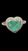 Columbian heart shaped emerald set in platinum sur