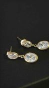 Pair of 9ct gold earrings set with white stones