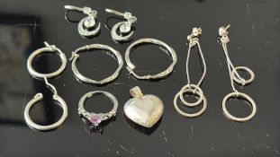 Collection of silver earrings to include a ring