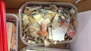 Collection of worldwide postage stamps in album and kiloware tubs