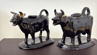 2x Black ceramic cow creamers