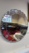 Mid-century circular glass wall mirror with floral rosettes