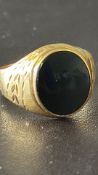 Yellow metal ring set with possible jet Weight 4.3