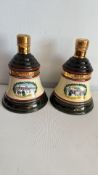 Pair of Bellâ€™s Scotch Whisky Christmas ceramic decanters, 1989 & 1990