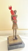 Bronze figure bomb hugger inspired by Banksy
