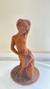 Cast iron garden statue of a nude woman