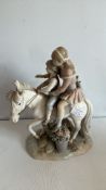 Lladro porcelain figure group â€œChildren Riding a Ponyâ€