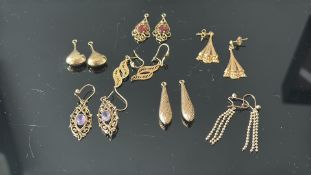 Collection of 7 pairs untested yellow metal earrin