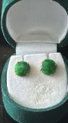 Pair of unmarked yellow metal earrings set with gr