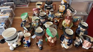 Collection of twenty-five ceramic character and toby jugs