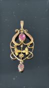 9ct Gold art nouveau pendant set with 2 pink stone