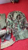 Mixed lot of British military surplus canvas webbing and clothing, including sleeping bag