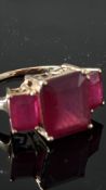 3 Stone ruby ring set in 10ct gold Total 12ct rubi