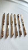 6 Silver handle knives