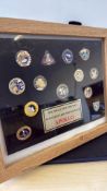 Collection of framed pin badges dedicated to the A