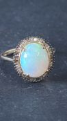 9ct Gold ring set with Ethiopian wello opal & diam