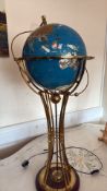 Illuminated gemstone floor globe on brass pedestal