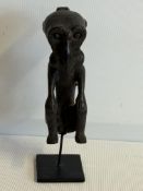 Ancestor figure made from red wood from Papua isla