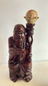 Hardwood Laughing Buddha with Crowned Gemstone Globe
