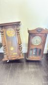 Pair of carved wooden pendulum wall clocks