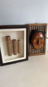 Framed Korean-style mask and carved bamboo cylinder display, pair