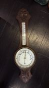 Carved oak aneroid barometer and thermometer, late Victorian