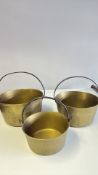 Set of three brass jam pans with iron handles