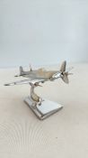 Small chrome spitfire on stand