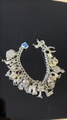 Silver charm bracelet Weight 74g