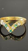 18ct Gold ring set with 4 diamonds & 3 emeralds We