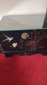Asian black lacquer chest with glass top