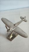 Metal desk model of a Spitfire aircraft