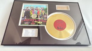 Framed Beatles Sgt Peppers gold disc