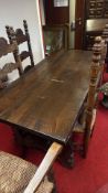 Rustic plank-top dining table with two rush-seat chairs