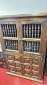 Spanish-style spindle and carved panel cupboard