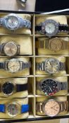 Collection of wristwatches in display case