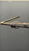 9ct Gold pin brooch set with amethyst Weight 1.2g