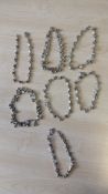 Group of 8 silver-tone charm bracelets/anklets