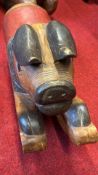 Polychrome carved wooden rocking pig figure