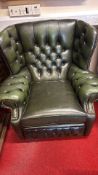 Green leather Chesterfield-style wingback armchair