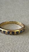 9ct Gold ring set with 7 sapphires Weight 1.7g Siz