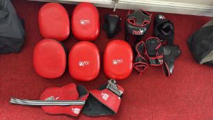 Group of martial arts training pads and protective gear