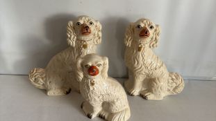 Trio of Staffordshire-style ceramic spaniel figures