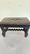 Carved wooden foot stool