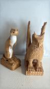 Pair of carved wooden animal sculptures