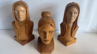 Set of three carved wooden female busts