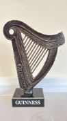 Cast iron Guinness harp on marble base