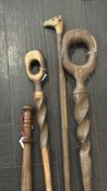 Group of Four Carved African Wooden Walking Sticks